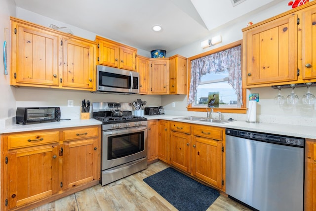 23180 Wimble Shores Dr Lot 8, Rodanthe, NC 27968 - kitchen with appliances with stainless steel finishes, a sink, light wood finished floors, light countertops, and recessed lighting