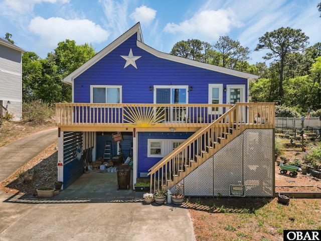 427 Harbour View Dr Unit Lot134-A, Kill Devil Hills, NC 27948 - back of house with stairs and a deck