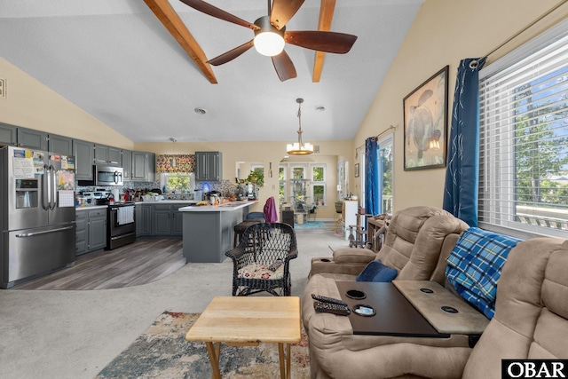 427 Harbour View Dr Unit Lot134-A, Kill Devil Hills, NC 27948 - living room featuring a ceiling fan, light colored carpet, high vaulted ceiling, and beamed ceiling