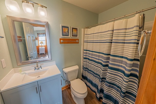 25200 Lela Ct Lot 6, Waves, NC 27982 - full bath with wood finished floors, toilet, vanity, curtained shower, and a textured wall