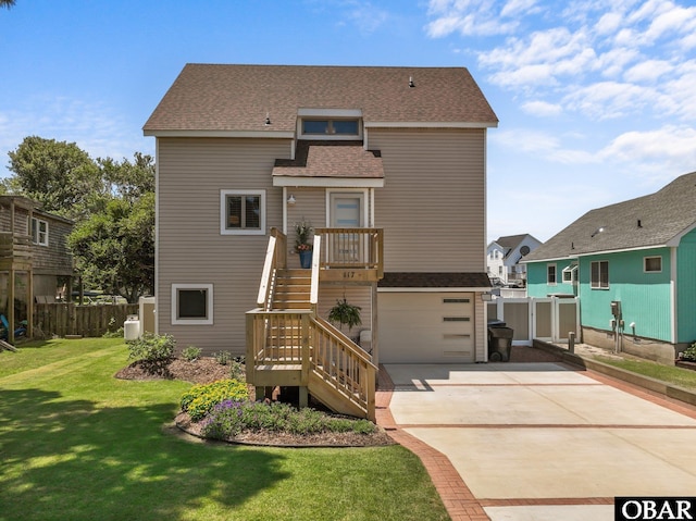 117 Broadbay Dr Lot 119, Kill Devil Hills, NC 27948 - back of house with concrete driveway, stairs, an attached garage, and roof with shingles