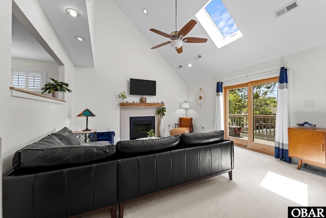 117 Broadbay Dr Lot 119, Kill Devil Hills, NC 27948 - living area featuring high vaulted ceiling, a fireplace, a skylight, light colored carpet, and a ceiling fan