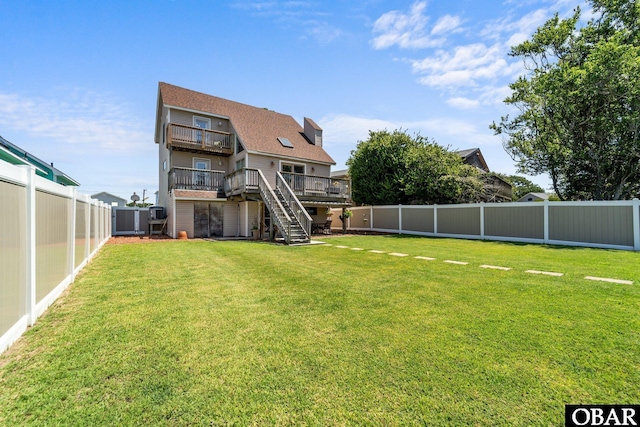 117 Broadbay Dr Lot 119, Kill Devil Hills, NC 27948 - back of property with stairway, a fenced backyard, and a wooden deck