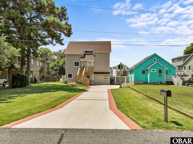 117 Broadbay Dr Lot 119, Kill Devil Hills, NC 27948 - view of front of home with concrete driveway, a garage, and stairway