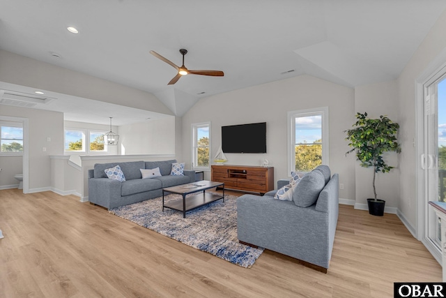 living room with vaulted ceiling, light wood-type flooring, and ceiling fan