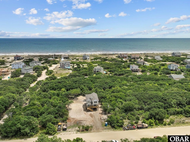 bird's eye view featuring a beach view and a water view