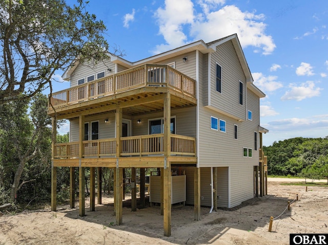 view of front of house featuring a carport and a wooden deck