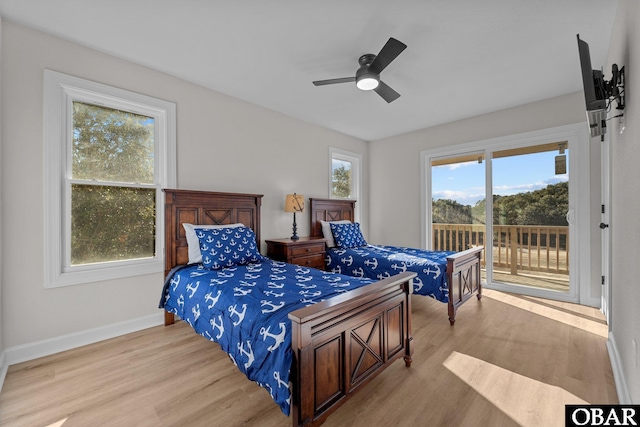 bedroom with access to exterior, ceiling fan, light wood finished floors, and baseboards