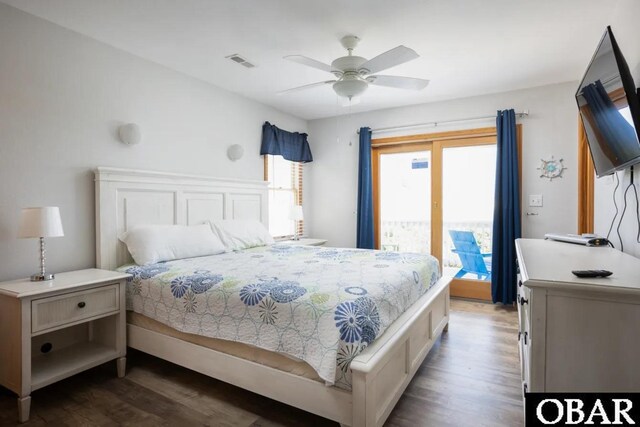 bedroom with access to outside, dark wood finished floors, visible vents, and a ceiling fan