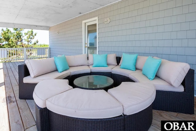 wooden terrace featuring outdoor lounge area