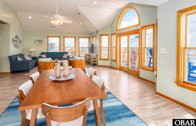 dining space with lofted ceiling, light wood-type flooring, baseboards, and recessed lighting