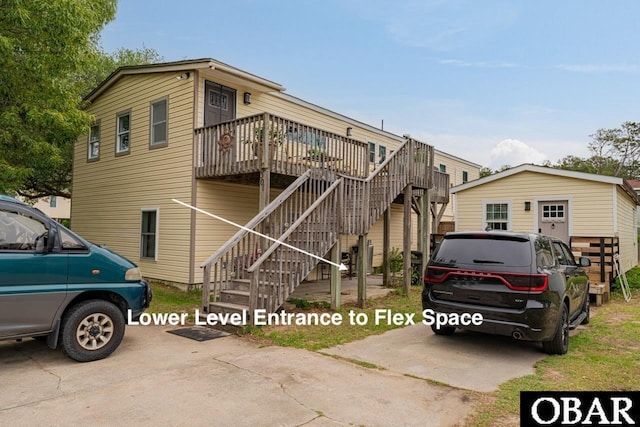 view of front facade featuring a deck and stairs