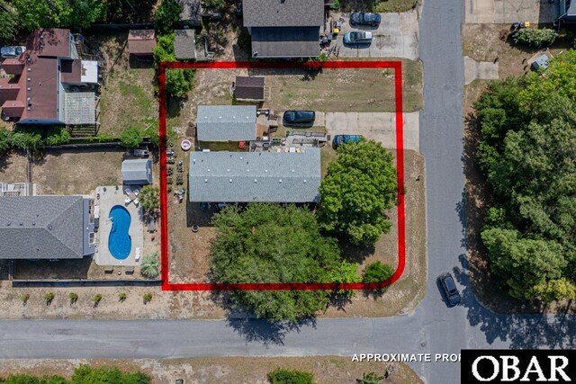 view of property location featuring a pool and property boundaries highlighted