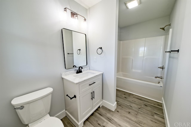 56185 Cedar Ave Lot 5, Hatteras, NC 27943 - bathroom featuring toilet, tub / shower combination, vanity, wood finished floors, and baseboards