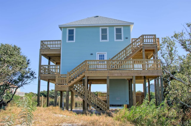 56185 Cedar Ave Lot 5, Hatteras, NC 27943 - back of house with stairs, a shingled roof, and a wooden deck