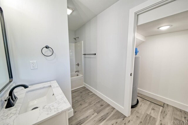 56185 Cedar Ave Lot 5, Hatteras, NC 27943 - bathroom with wood finished floors, bathtub / shower combination, vanity, and baseboards