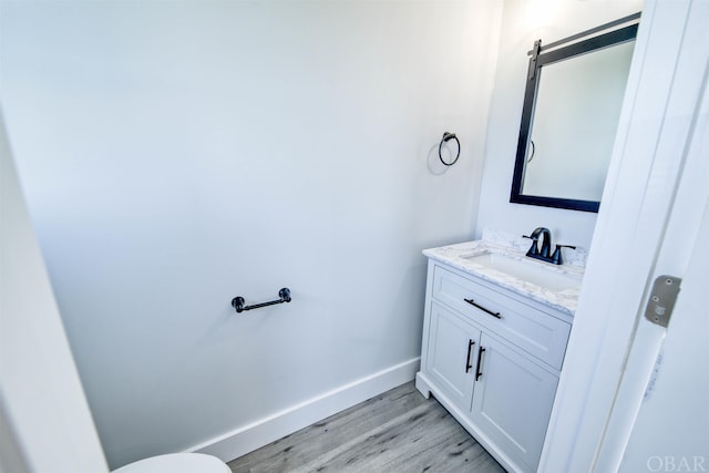 56185 Cedar Ave Lot 5, Hatteras, NC 27943 - half bath with wood finished floors, vanity, and baseboards