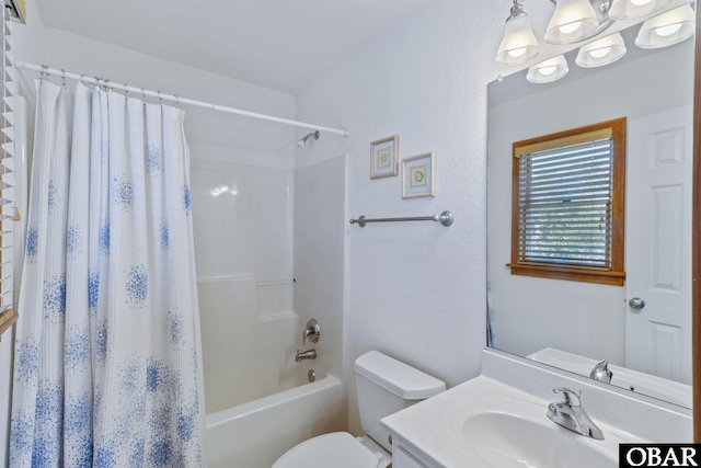 full bath with shower / bath combination with curtain, vanity, and toilet