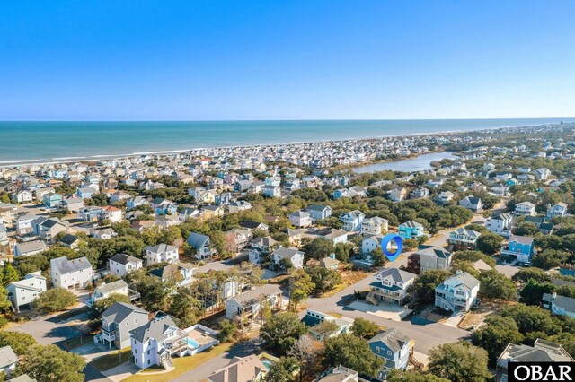 birds eye view of property featuring a water view and a residential view