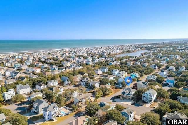 birds eye view of property with a residential view and a water view