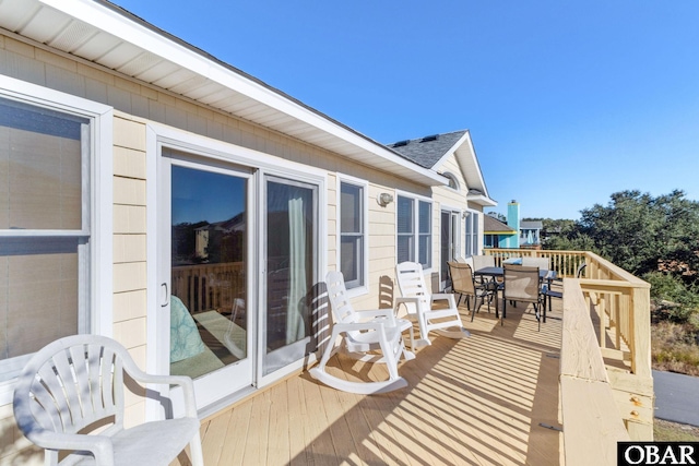 wooden deck with outdoor dining space