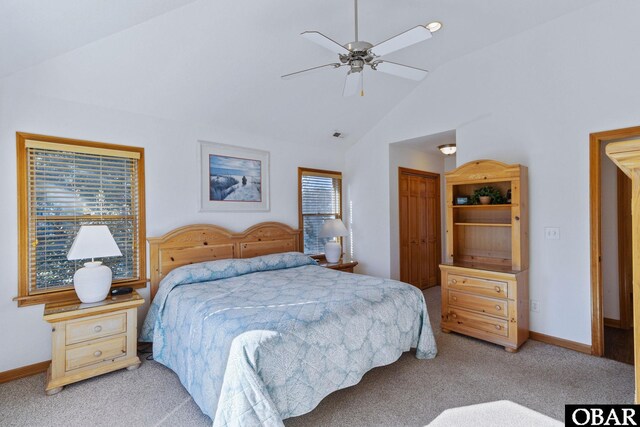 bedroom featuring light carpet, baseboards, lofted ceiling, ceiling fan, and a closet