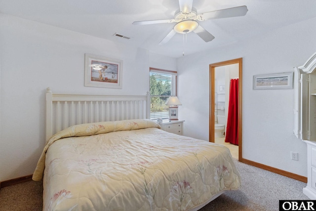 bedroom with light carpet, baseboards, visible vents, a ceiling fan, and ensuite bathroom