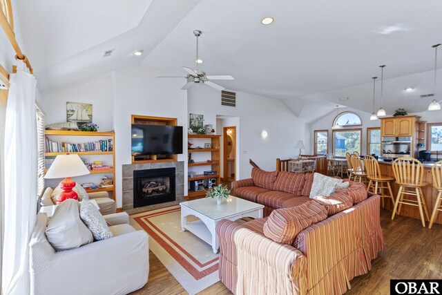 living area with ceiling fan, recessed lighting, a fireplace, wood finished floors, and visible vents