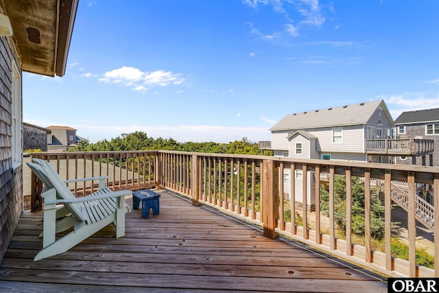 wooden terrace featuring a residential view