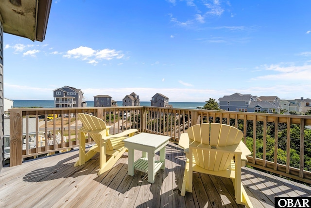 wooden deck with a water view