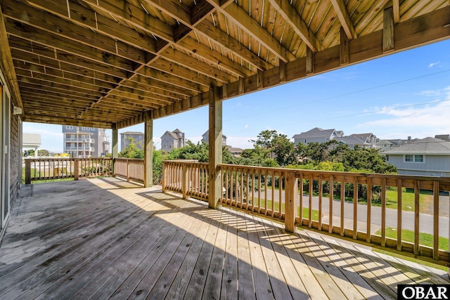 wooden deck with a residential view