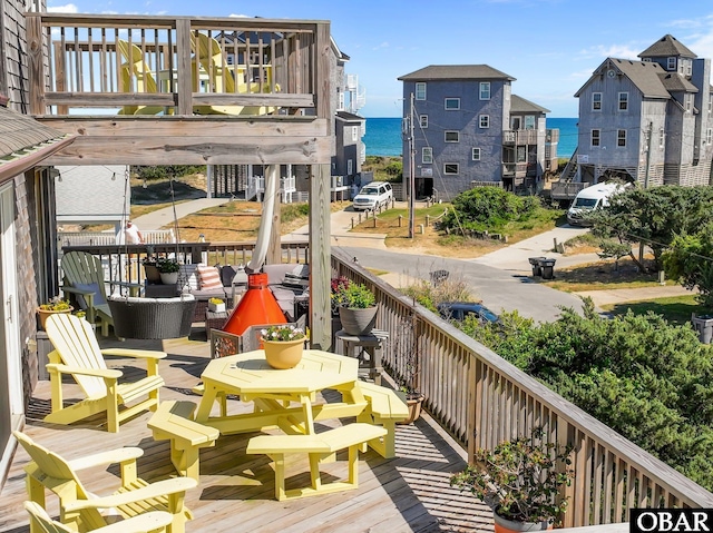 balcony with a deck with water view