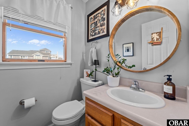 bathroom with vanity and toilet
