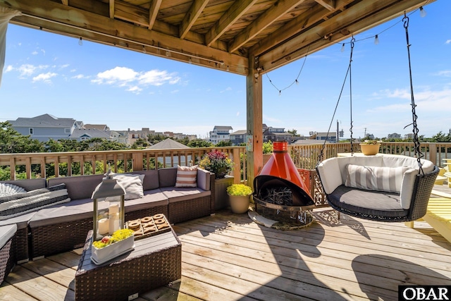 wooden terrace featuring outdoor lounge area