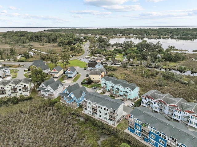 bird's eye view featuring a water view and a residential view