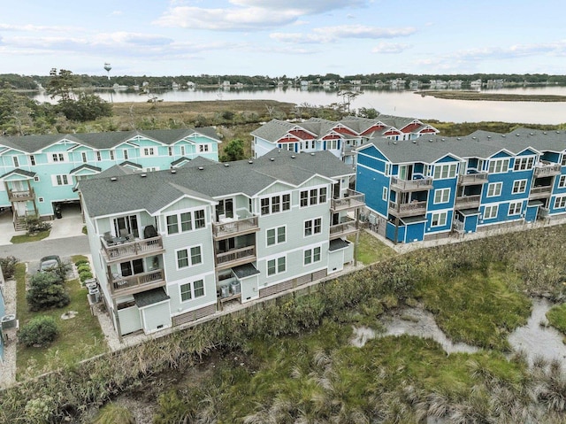 birds eye view of property featuring a residential view and a water view