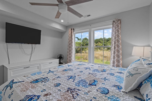 bedroom with visible vents and a ceiling fan