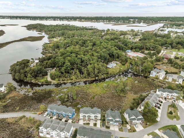 bird's eye view with a water view and a residential view