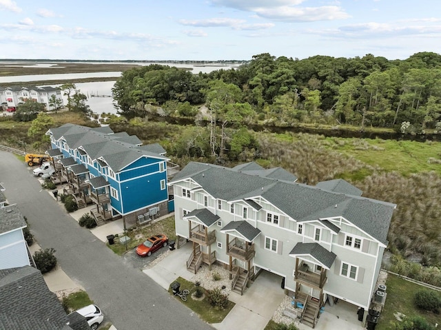 birds eye view of property with a residential view and a water view