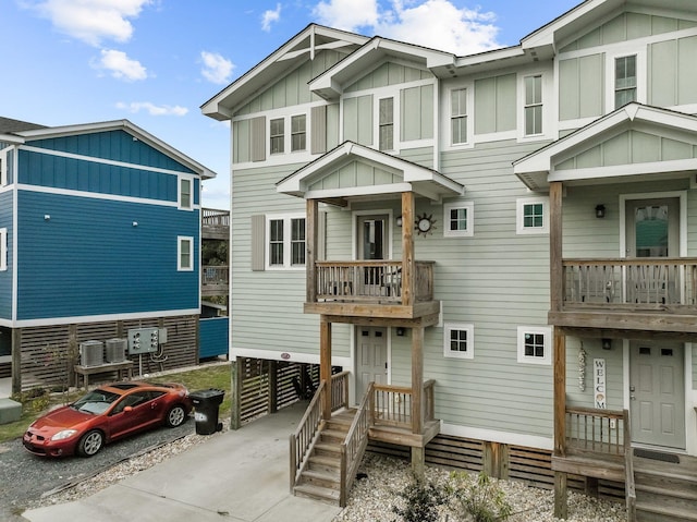 view of front of property with central AC and board and batten siding