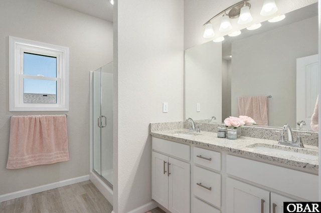 1804 Harbour View Dr Lot 91-O, Kill Devil Hills, NC 27948 - bathroom with double vanity, wood finished floors, and a shower stall