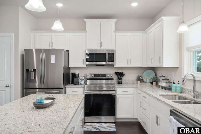 1804 Harbour View Dr Lot 91-O, Kill Devil Hills, NC 27948 - kitchen with appliances with stainless steel finishes, white cabinetry, light stone counters, decorative light fixtures, and recessed lighting