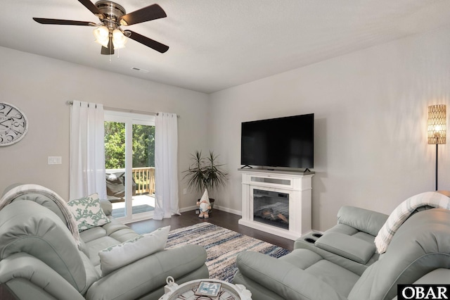 1804 Harbour View Dr Lot 91-O, Kill Devil Hills, NC 27948 - living area with wood finished floors, ceiling fan, and a glass covered fireplace