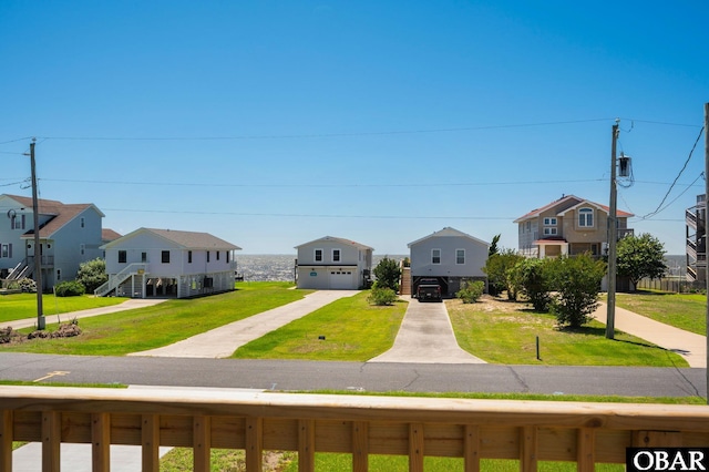 1804 Harbour View Dr Lot 91-O, Kill Devil Hills, NC 27948 - beach home featuring a residential view, a front yard, a detached garage, and driveway