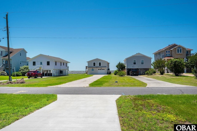 1804 Harbour View Dr Lot 91-O, Kill Devil Hills, NC 27948 - view of front of property with a residential view, driveway, a front lawn, and an attached garage