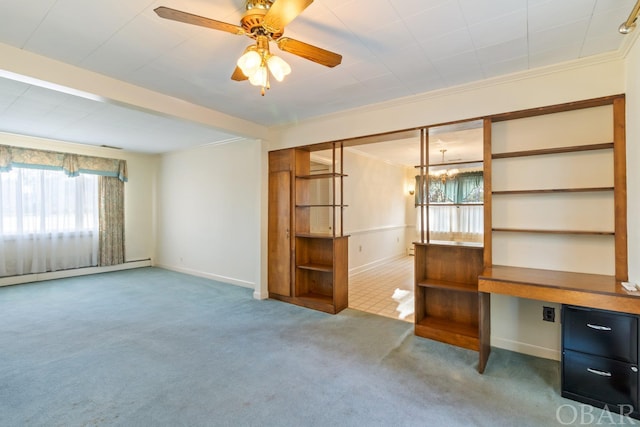 interior space with a baseboard heating unit, a ceiling fan, baseboards, ornamental molding, and beamed ceiling