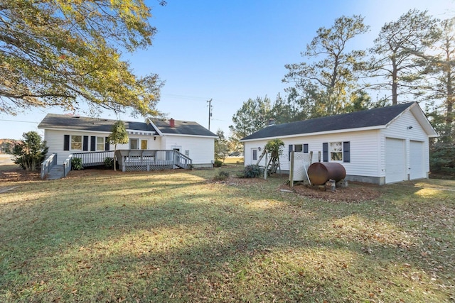 3858 Caratoke Hwy, Maple, NC 27956 - back of property featuring heating fuel, a deck, a lawn, a detached garage, and an outbuilding