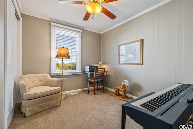 interior space featuring carpet floors, visible vents, ornamental molding, a ceiling fan, and baseboards