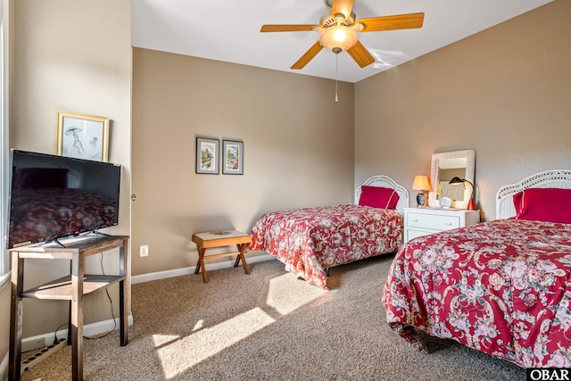 carpeted bedroom featuring ceiling fan and baseboards