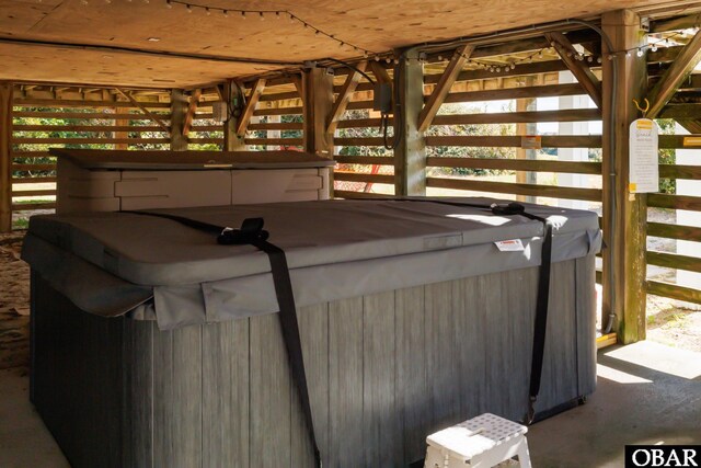 exterior space with a hot tub and a gazebo